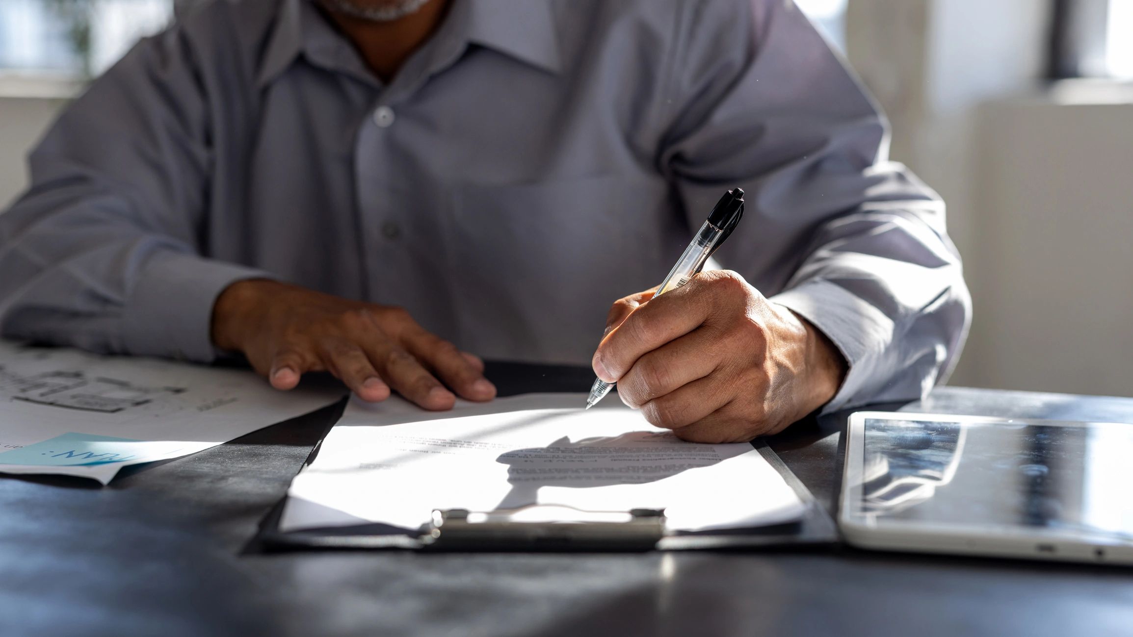 Attorney reviewing legal documents at a desk